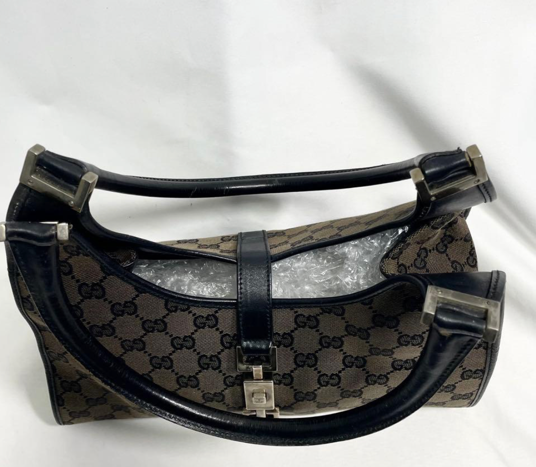 Gucci Jackie en toile GG Canvas noire / beige.