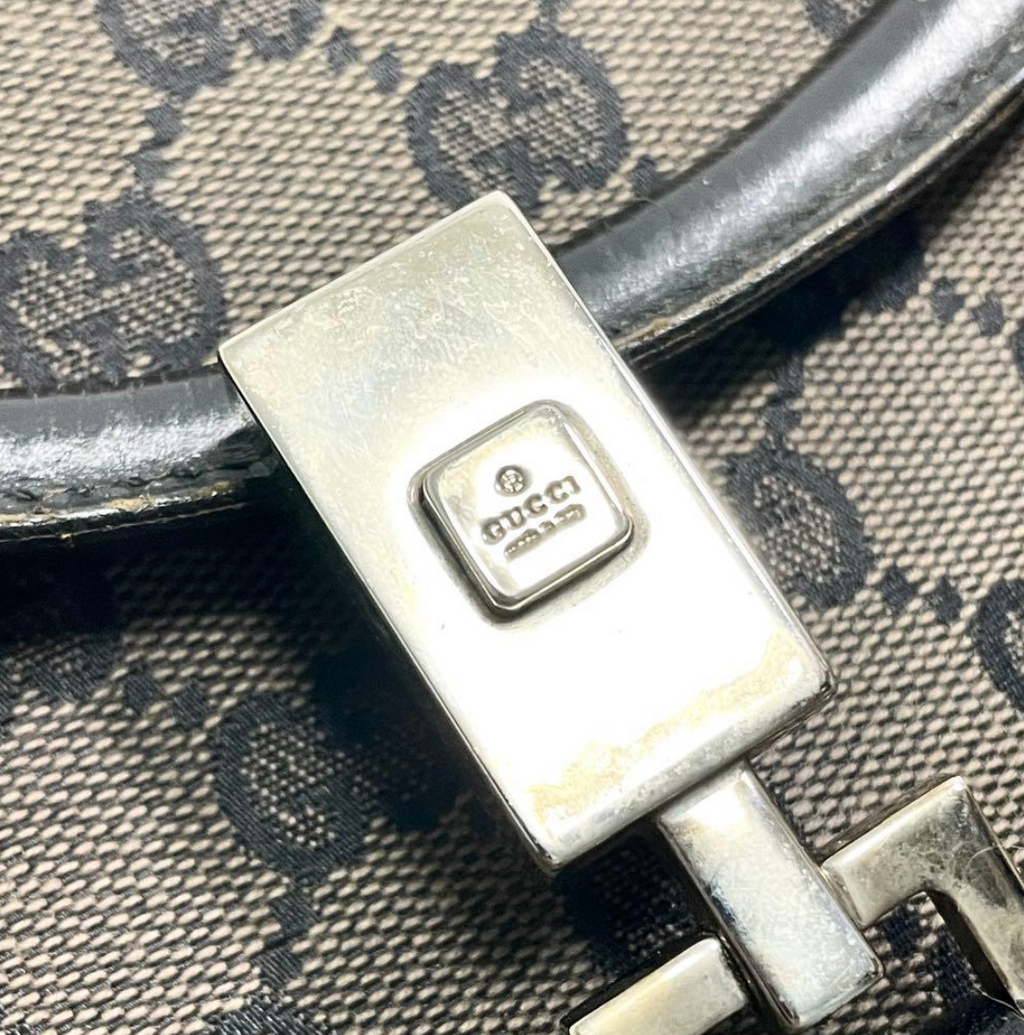 Gucci Jackie en toile GG Canvas noire / beige.